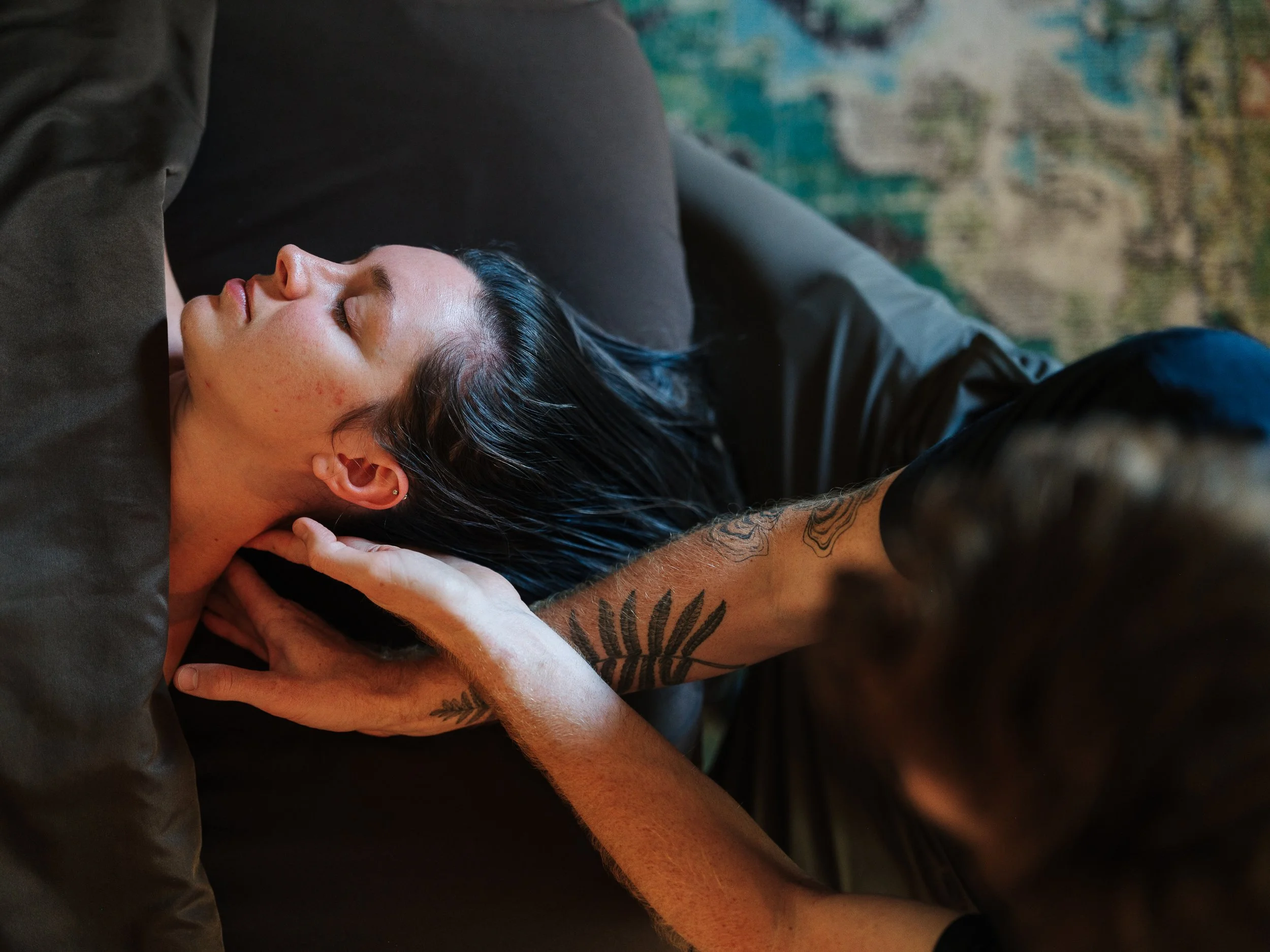 Woman with neck tension needing massage therapy in Asheville NC