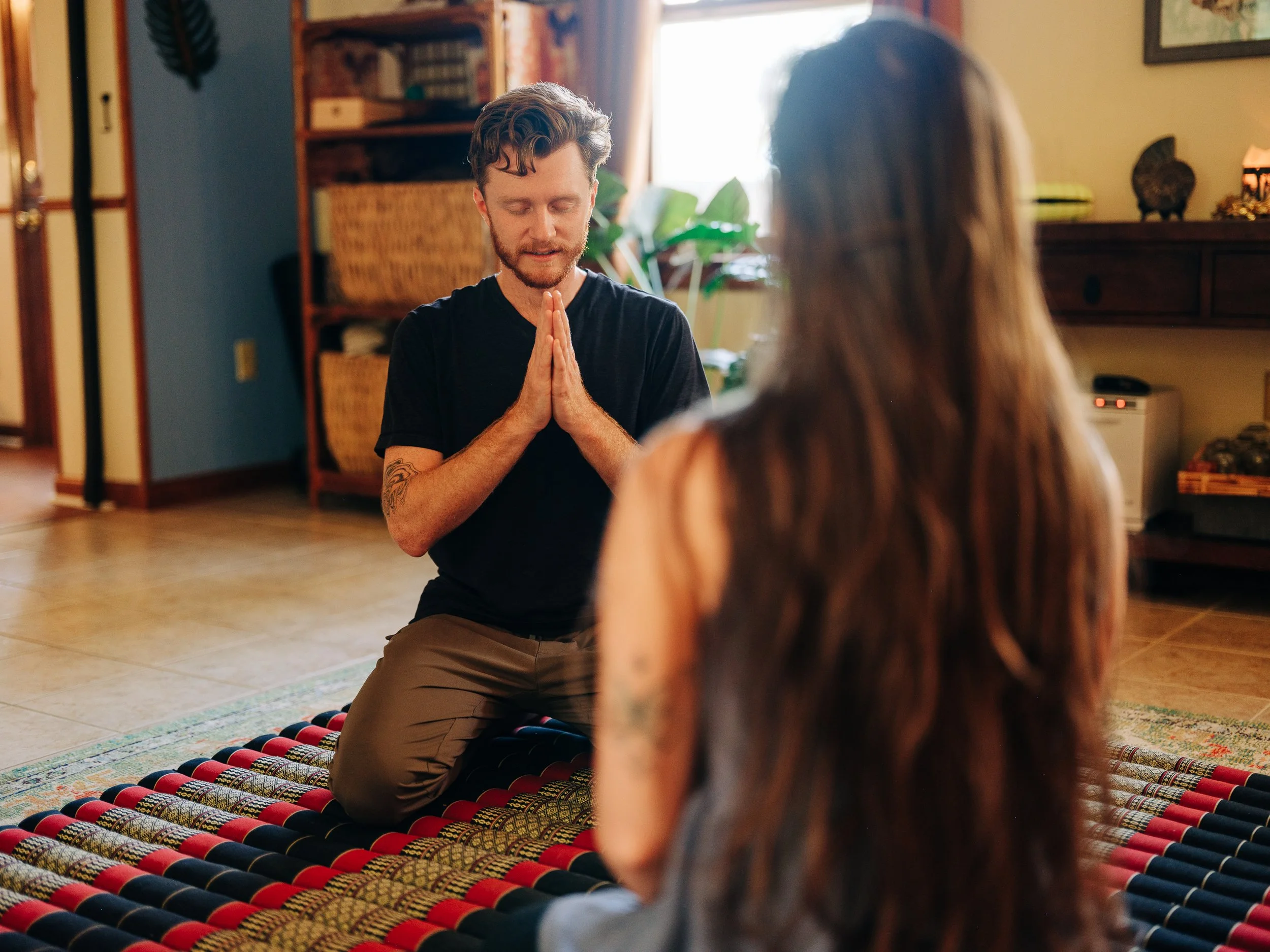 Michael in prayer pose before beginning bodywork