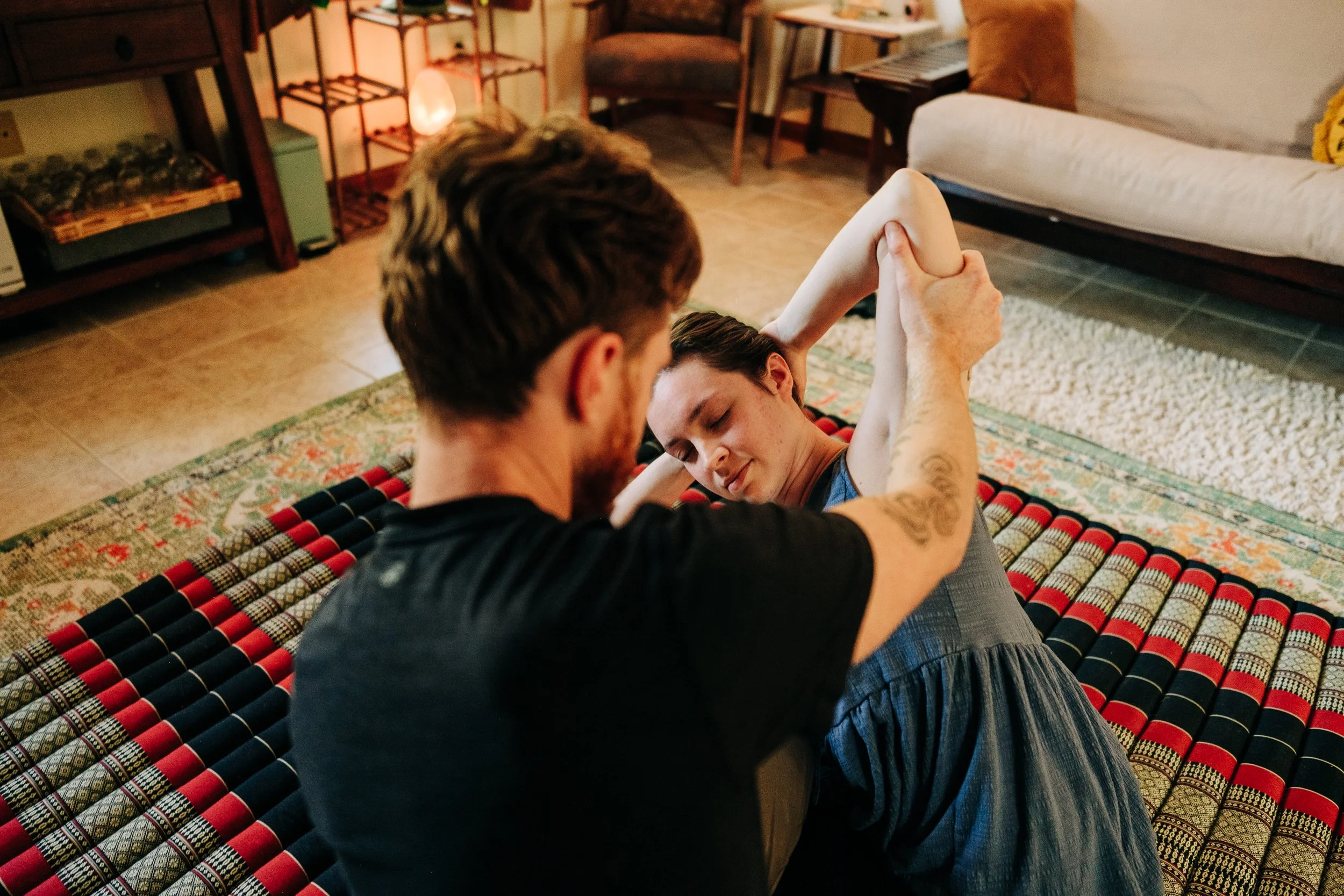 Thai massage floor work at Zen Fox Healing Arts West Asheville