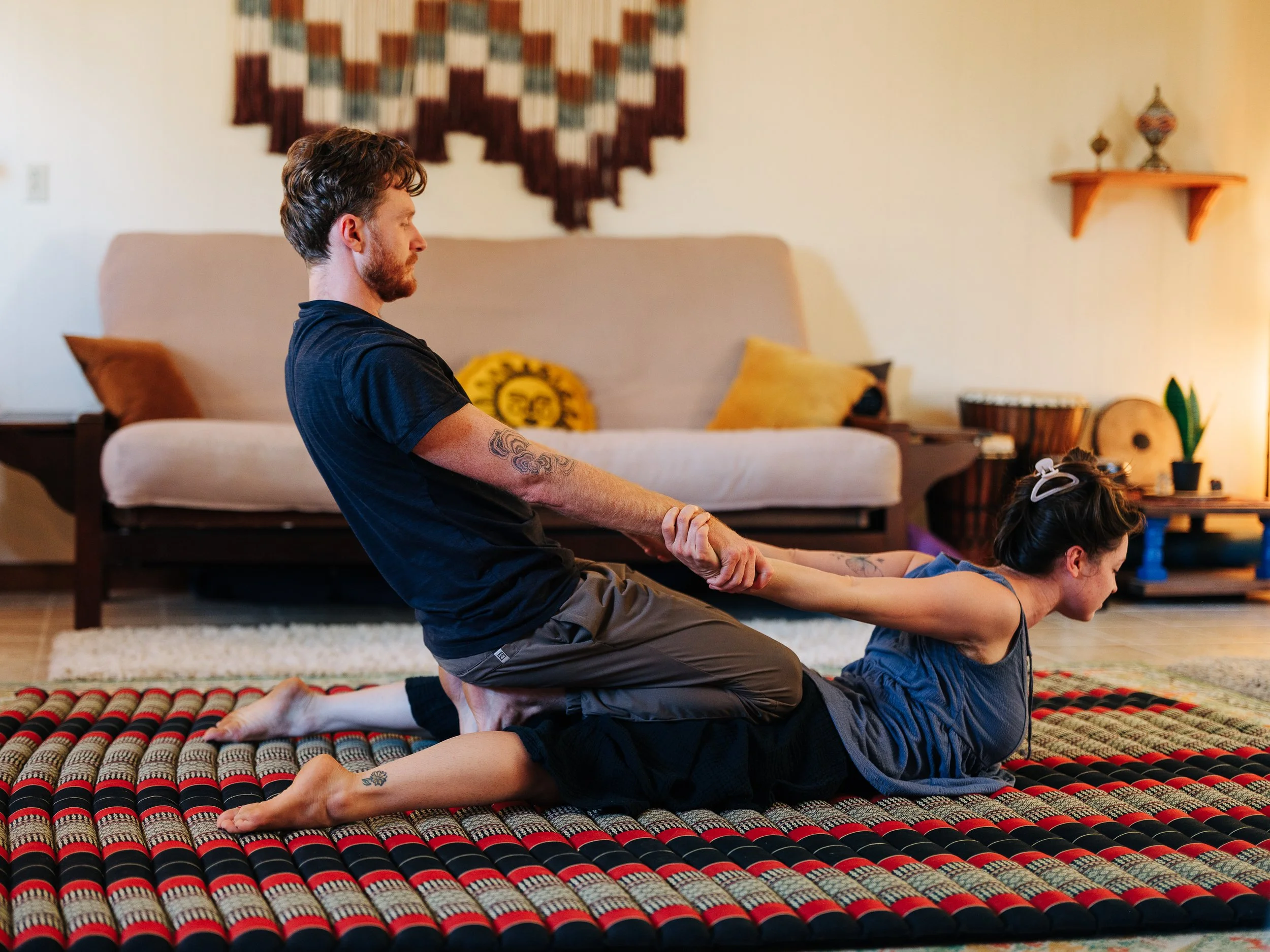Traditional Thai massage stretch at Asheville bodywork studio